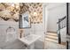 Stylish powder room with designer wallpaper, vanity, and wainscoting detail at 132 Mount Vernon Dr, Decatur, GA 30030