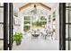 Bright sunroom with vaulted ceiling and access to backyard and outdoor seating at 132 Mount Vernon Dr, Decatur, GA 30030