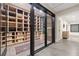 Spacious wine cellar with custom shelving and glass door and space for wine storage at 132 Mount Vernon Dr, Decatur, GA 30030