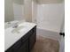 Bathroom featuring a tub-shower combination with a single sink vanity at 1474 Union Station, Lawrenceville, GA 30045
