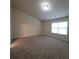 Neutral bedroom featuring carpeted floors, a window letting in natural light, and ample space at 1474 Union Station, Lawrenceville, GA 30045