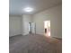 Bedroom featuring a carpeted floor, neutral walls, and open doorway at 1474 Union Station, Lawrenceville, GA 30045