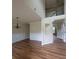 Bright living room featuring hardwood floors, fresh paint, and a chandelier with easy access to the second story at 1474 Union Station, Lawrenceville, GA 30045