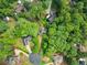 Aerial view of the home nestled among mature trees and a private cul-de-sac at 1620 Bluewater Ct, Cumming, GA 30041