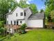 Back exterior of home with large deck and access to backyard at 1620 Bluewater Ct, Cumming, GA 30041