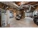 Unfinished basement with visible ductwork and supports, perfect for storage and renovations at 1620 Bluewater Ct, Cumming, GA 30041