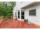Wooden deck overlooking lush greenery, perfect for outdoor enjoyment and entertainment at 1620 Bluewater Ct, Cumming, GA 30041