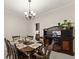 Cozy dining area with a chandelier and a large buffet, perfect for Gathering gatherings at 1620 Bluewater Ct, Cumming, GA 30041