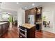 Kitchen area showcases stainless steel appliances, granite countertops, and an adjacent dining space at 1620 Bluewater Ct, Cumming, GA 30041