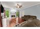 Cozy living room with hardwood floors, fireplace, and comfortable seating at 1620 Bluewater Ct, Cumming, GA 30041