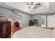 Spacious main bedroom featuring hardwood floors, vaulted ceilings, and attached office at 1620 Bluewater Ct, Cumming, GA 30041
