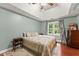 Serene main bedroom with vaulted ceiling, hardwood floors, and ample natural light at 1620 Bluewater Ct, Cumming, GA 30041