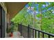 A serene balcony with lovely green trees and foliage in the background at 28305 Plantation Ne Dr, Atlanta, GA 30324