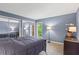 Comfortable bedroom featuring mirrored closet doors and ample natural light at 28305 Plantation Ne Dr, Atlanta, GA 30324
