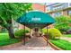 Inviting walkway leading to building entrance, featuring well-maintained landscaping and covered drop-off at 28305 Plantation Ne Dr, Atlanta, GA 30324