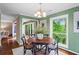 Comfortable dining area features natural light, creating an inviting space for meals and gatherings at 28305 Plantation Ne Dr, Atlanta, GA 30324