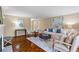 Spacious living room with hardwood floors and elegant furnishings, great for entertaining guests or relaxing at 28305 Plantation Ne Dr, Atlanta, GA 30324