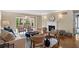 Bright living room with hardwood floors, fireplace, and access to a balcony provides elegant living space at 28305 Plantation Ne Dr, Atlanta, GA 30324