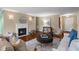 Bright living room features a cozy fireplace, comfortable seating, and stylish decor for relaxation and enjoyment at 28305 Plantation Ne Dr, Atlanta, GA 30324