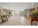Spacious building lobby area with tile flooring, seating, elevator and an abundance of natural light at 28305 Plantation Ne Dr, Atlanta, GA 30324