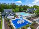 Aerial view showing community pool, playground, clubhouse, and shaded lounge areas at 31 Brownson Ct, Acworth, GA 30101