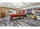Basement game room with pool table, stone archway, and sports-themed decor at 31 Brownson Ct, Acworth, GA 30101
