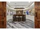 Stylish basement bar area with wood beam lighting and sports memorabilia at 31 Brownson Ct, Acworth, GA 30101