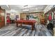 Basement entertainment area with pool table, dining set, and stone archway at 31 Brownson Ct, Acworth, GA 30101