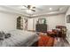 Comfortable bedroom featuring a ceiling fan and en suite bathroom at 31 Brownson Ct, Acworth, GA 30101