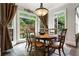 Bright dining room features large windows, hardwood floors, and a stylish chandelier at 31 Brownson Ct, Acworth, GA 30101