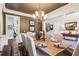 Dining room with hardwood floors, wainscoting and modern chandelier with chairs around a table at 31 Brownson Ct, Acworth, GA 30101