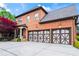 Charming brick home showcasing a three-car garage and covered front porch entry at 31 Brownson Ct, Acworth, GA 30101