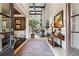 Grand foyer with high ceilings, detailed trim, staircase and view into other rooms with wood and tile floors at 31 Brownson Ct, Acworth, GA 30101