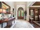 Inviting foyer with high ceilings and detailed trim with a view to the front door, dining and living area at 31 Brownson Ct, Acworth, GA 30101