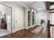 Hallway featuring hardwood floors and built-in shelving at 31 Brownson Ct, Acworth, GA 30101