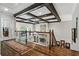 Hallway featuring hardwood floors, coffered ceiling, and iron railing at 31 Brownson Ct, Acworth, GA 30101
