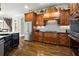 Gourmet kitchen with stainless steel appliances and beautiful dark wood cabinets at 31 Brownson Ct, Acworth, GA 30101