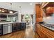 Open kitchen featuring stainless appliances, breakfast nook, and hardwood floors at 31 Brownson Ct, Acworth, GA 30101