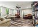 Living room featuring natural light, cozy furniture, and hardwood floors at 31 Brownson Ct, Acworth, GA 30101