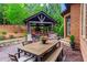 Outdoor patio featuring an outdoor kitchen, seating, and manicured lawn at 31 Brownson Ct, Acworth, GA 30101