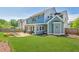 Two-story home with a spacious green lawn, patio with outdoor seating, and fenced yard at 3909 Obryant Se Cir, Smyrna, GA 30082