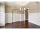 Formal dining room featuring hardwood floors, wainscoting, and an elegant chandelier at 3909 Obryant Se Cir, Smyrna, GA 30082