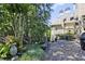 Stone patio and lush garden with a view of the home's exterior at 5118 Greythorne Ln, Marietta, GA 30068