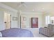 Bright bedroom showcasing recessed lighting, a window with shutters, and access to an en-suite bathroom at 5118 Greythorne Ln, Marietta, GA 30068