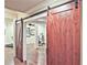 Bonus room featuring wood floors and a rustic sliding barn door at 5118 Greythorne Ln, Marietta, GA 30068