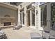 Large wooden deck with a fireplace and multiple glass doors at 5118 Greythorne Ln, Marietta, GA 30068
