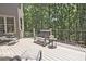 Comfortable deck area with seating overlooking a treed backyard at 5118 Greythorne Ln, Marietta, GA 30068