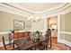 Charming dining room with elegant details, chandelier, and convenient butler's pantry at 5118 Greythorne Ln, Marietta, GA 30068