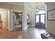 Welcoming foyer with hardwood floors, decorative mirror, and a view to the study at 5118 Greythorne Ln, Marietta, GA 30068