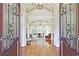 Grand foyer with hardwood floors, detailed trim, and an open view to the living room at 5118 Greythorne Ln, Marietta, GA 30068